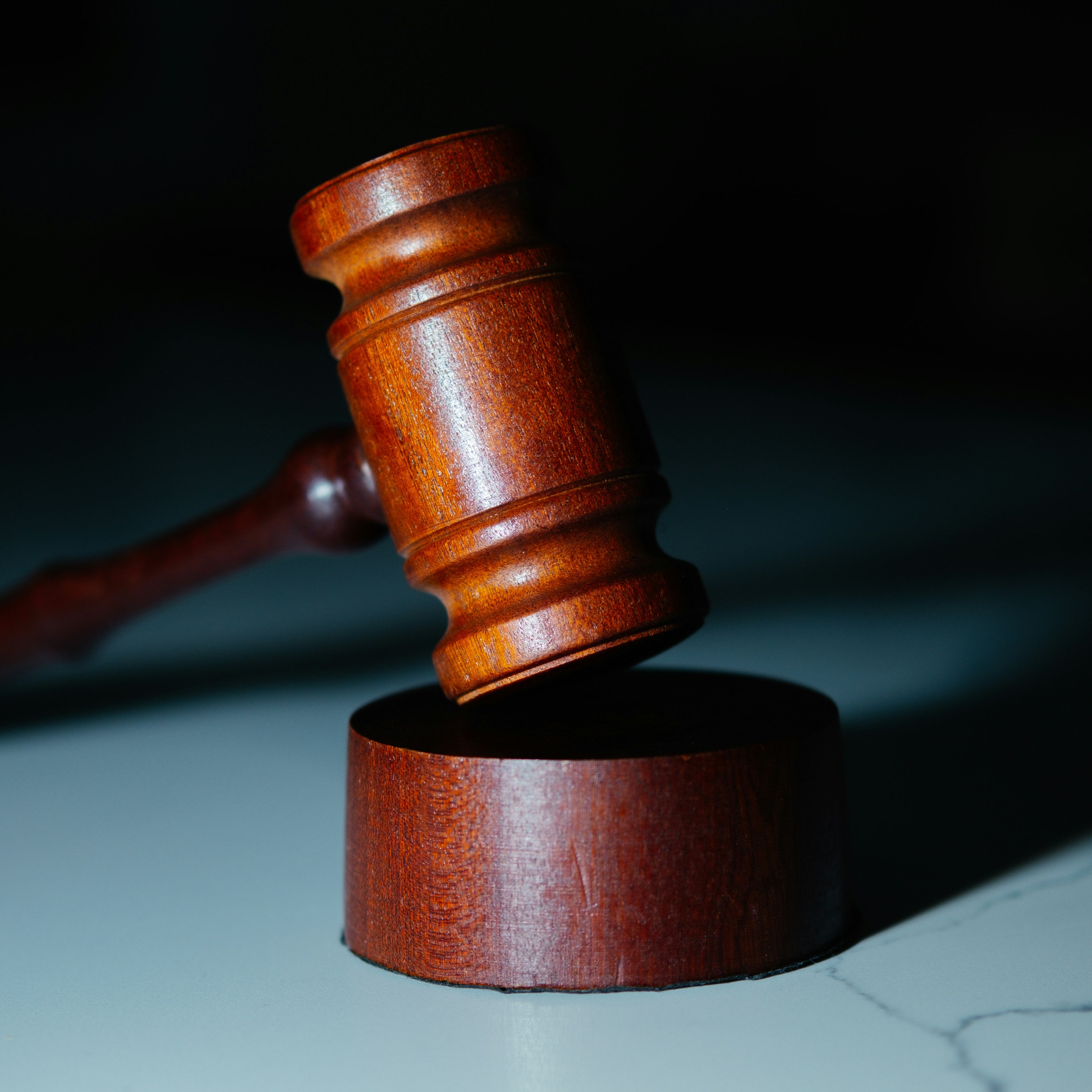 A gavel in a dark room